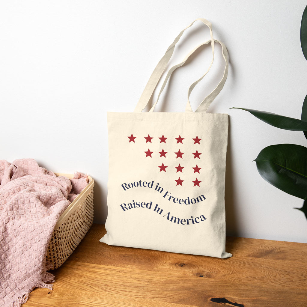 Patriotic Canvas Tote — “Rooted in Freedom, Raised in America”